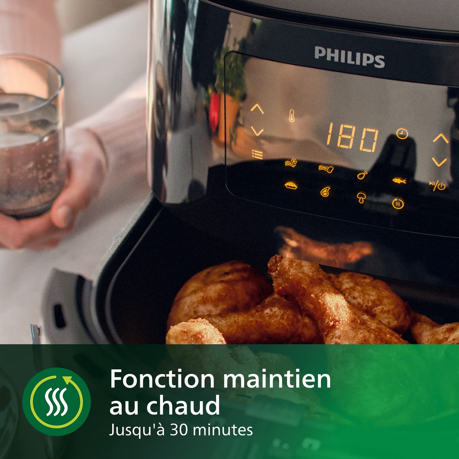Écran tactile du Philips Airfryer XL HD9270/90 réglé sur 180 degrés, tiroir ouvert sur des pilons de poulet dorés en cours de cuisson